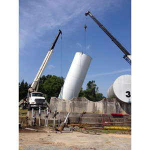 Tank farm demolition project – cranes being used to load up tanks.