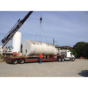 Tank farm demolition project – cranes being used to load up tanks.